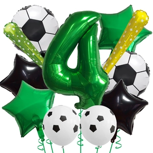 Detail of soccer themed party set featuring large green number 4 and football foil balloons