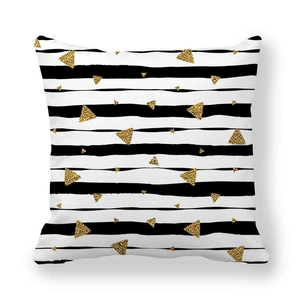 Detail of peach skin pillowcase with black stripes and golden glitter triangles