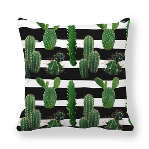 Detail view of square pillowcase with black stripes and green cactus patterns