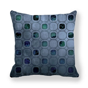 Close-up of geometric peach skin pillowcase with blue and green abstract floral patterns