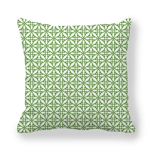 Détail du motif géométrique vert sur une taie d'oreiller blanche en peau de pêche