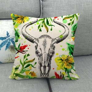 Linen sofa pillow cover featuring a watercolor bull skull and yellow flower pattern
