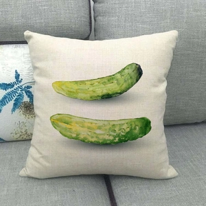 Close-up of linen pillowcase with watercolor cucumber print on a grey sofa