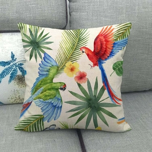 Detailed close-up of tropical parrot and palm leaf print on linen throw pillow cover