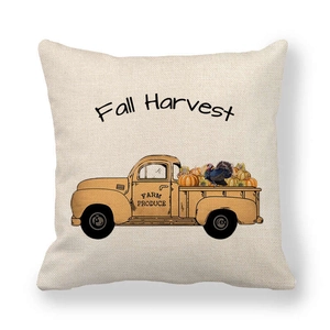 Close-up of linen pillowcase with vintage yellow truck and Fall Harvest pumpkin print