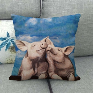 Detail of artistic oil painting pig pattern cushion cover on a grey fabric sofa