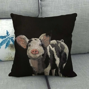 Close-up of a vintage colorful pig art print on a square black cotton linen pillowcase