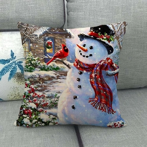 Kissenbezug aus Leinen mit Weihnachtsschneemann und rotem Vogel auf einem Sofa
