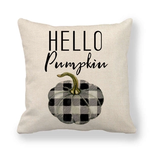 Detail of linen pillowcase featuring a black buffalo check pumpkin and Hello Pumpkin text