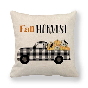 Detail of linen pillowcase featuring a harvest truck, pumpkins, and Fall Harvest text