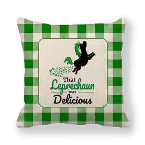 Close-up of St. Patrick's Day green plaid linen pillowcase with funny unicorn print