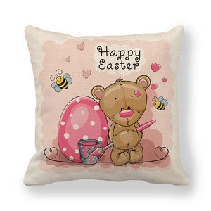 Detail of linen Easter cushion cover showing texture and cute bear with pink egg pattern