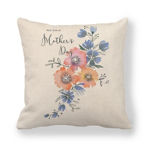 Close-up of linen pillowcase with colorful floral pattern and Mother's Day text