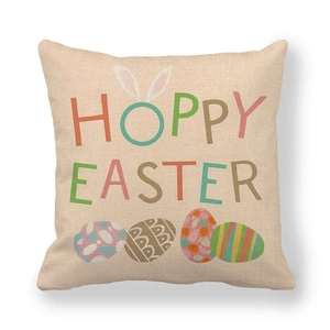 Close-up of linen Easter pillowcase texture with Hoppy Easter text and colorful eggs