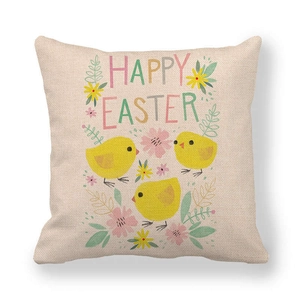 Detail of linen Easter cushion cover featuring happy easter text and yellow chicks