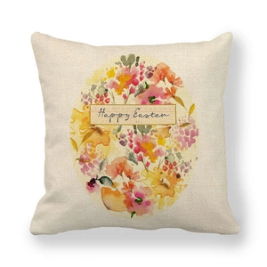 Close-up of linen Easter pillowcase featuring floral egg design and Happy Easter text