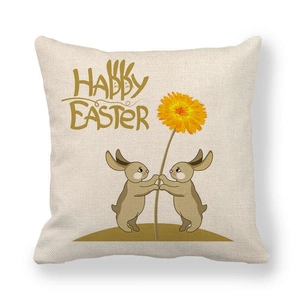 Dettaglio copricuscino in lino con coniglietti Happy Easter e motivo a dente di leone