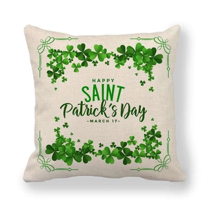Linen St. Patrick's Day cushion cover featuring green clovers and festive text on white