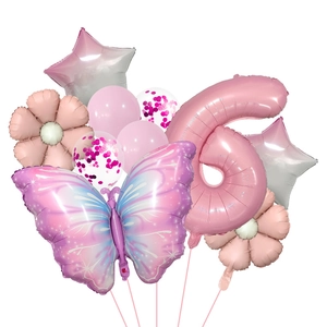 Detail of pink number 6 and purple butterfly foil balloons for birthday party decor