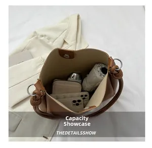 Top view of brown bucket bag interior showing large capacity for essentials