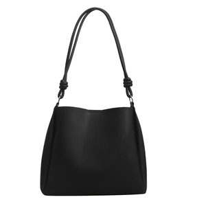 Minimalist black oversized soft leather tote bag featuring unique shoulder strap knot details