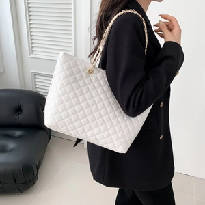 White quilted tote bag with golden chain strap for women, minimalist large capacity design