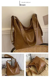 Détails du grand sac hobo marron en cuir synthétique avec poches latérales et bandoulières