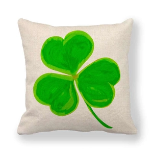 Detailed view of linen pillowcase with green shamrock print for St. Patrick's Day decor