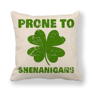 Detail view of St. Patrick's Day linen pillow cover with lucky clover and vintage text