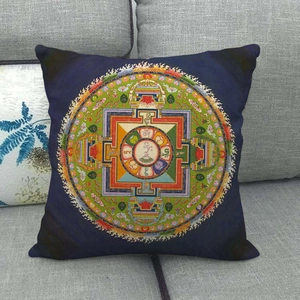 Close-up of geometric mandala pattern on navy blue linen-style throw pillow cover