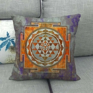 Detail of square linen pillowcase with orange and purple Sri Yantra geometric pattern