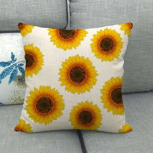 Detailed texture of linen sunflower throw pillow case on a grey fabric sofa