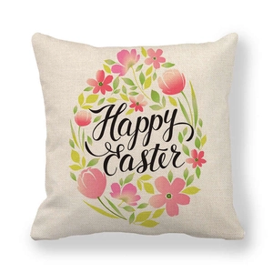 Detail of Easter linen pillowcase showing colorful floral wreath and Happy Easter text