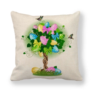 Detail of linen pillowcase with colorful Easter egg tree embroidery and butterfly motifs