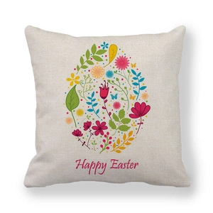Detail of linen cushion cover featuring floral Easter egg design and Happy Easter text
