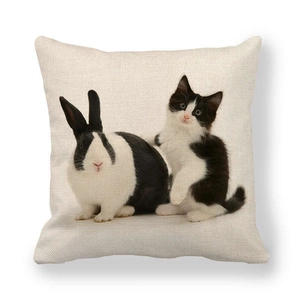 Detail shot showing the woven linen texture and cute bunny with cat prints on the pillowcase