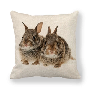 Detailed close-up of rabbit print on a square linen throw pillow with fabric texture