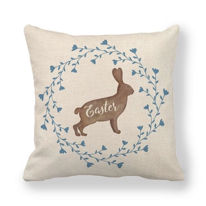 Linen Easter pillow cover featuring a brown bunny silhouette and floral wreath design