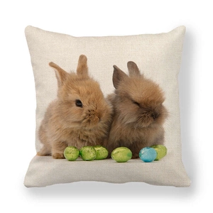 Linen Easter pillow cover with brown rabbits and colorful eggs on white background