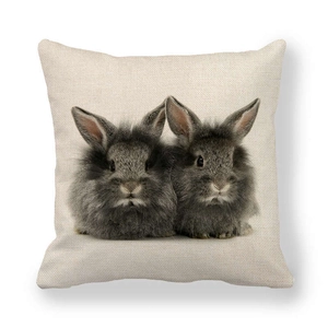 Square linen pillow cover with realistic gray rabbit prints on a cream background