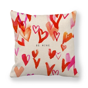 Close-up of Valentine's Day linen pillowcase with hearts and Be Mine text design