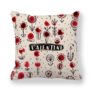 Detailed close-up of a linen Valentine pillowcase with red floral print and lettering