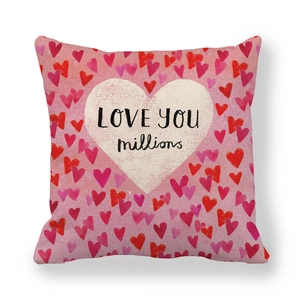 Detail of linen pillowcase with heart pattern and LOVE YOU millions text print