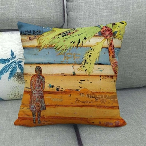 Artistic linen pillowcase featuring a retro painted portrait and palm leaf on a sofa