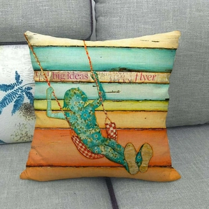 Artistic linen pillow cover with silhouette of girl on swing and teal floral patterns