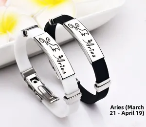 Aries Silikon-Armbänder in Schwarz und Weiß mit gravierter Edelstahlplatte im Detail