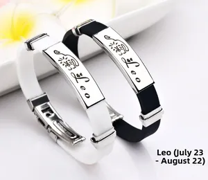 Detail von schwarz-weißen Silikon-Sternzeichen-Armbändern mit Leo-Edelstahlgravur