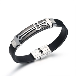 Close-up of a men's cross bracelet with black silicone and a stainless steel clasp