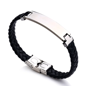 Close-up of braided leather bracelet with polished stainless steel ID tag and folding clasp