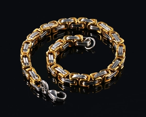 Detail view of Byzantine chain with dual-tone gold and silver links and lobster clasp